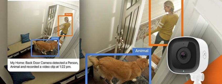 An Alarm.com security system identifies a person and a dog walking out the door.