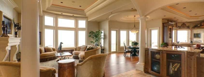 An open living space featuring in-ceiling speakers as part of a whole-home audio system.