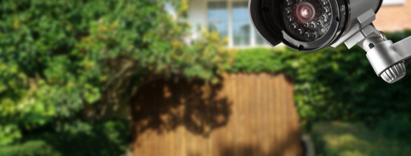 A surveillance camera overlooking a backyard.