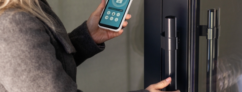 Female,Hand,Holding,Black,Mobile,Smart,Phone,With,Smart,Home